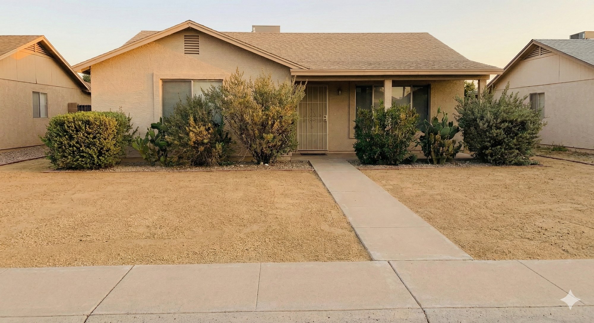 Front yard after: trimmed, fresh rock, clean edges